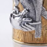 Detail of the master craftsman's signature of the champagne bottle cover Falcon