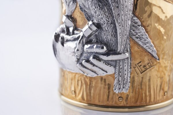 Detail of the master craftsman's signature of the champagne bottle cover Falcon